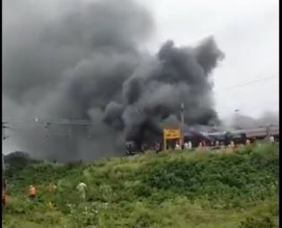 Smoke coming out of the burnt Coach