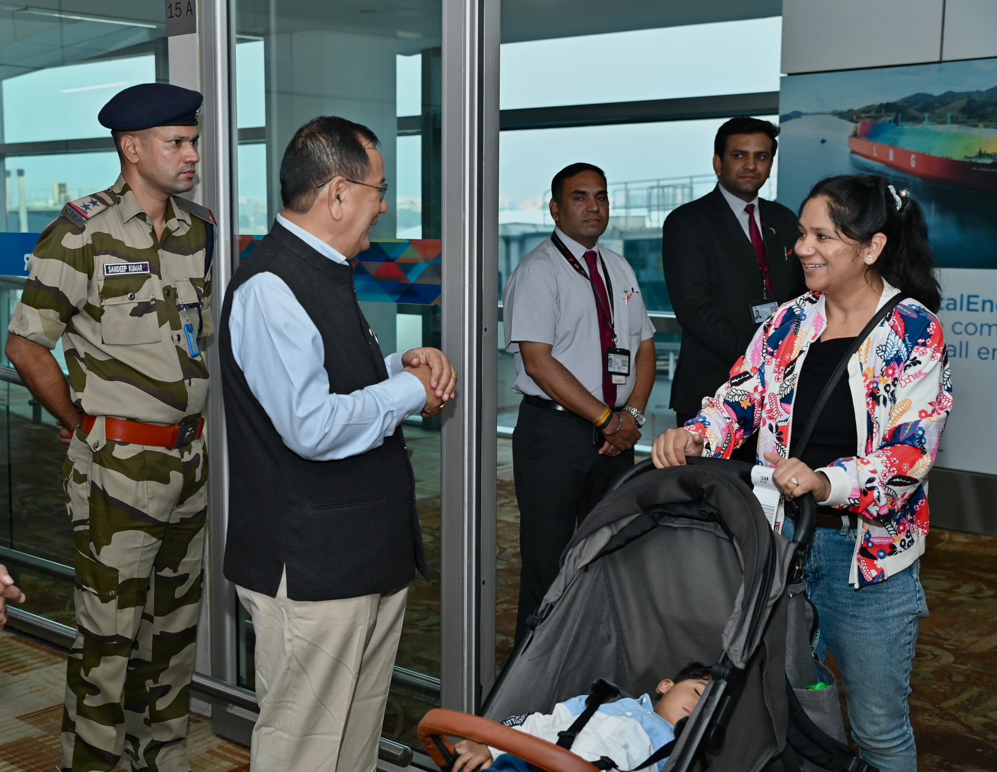 Minister of state Ranjan Rajkumar welcoming Passengers from Second flight